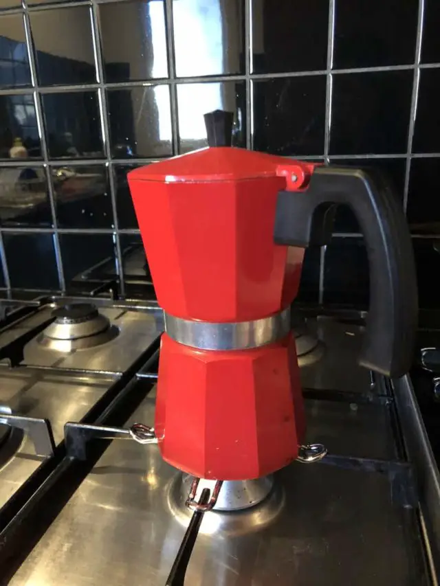 Red coffee moka pot on stove | frugality attempt