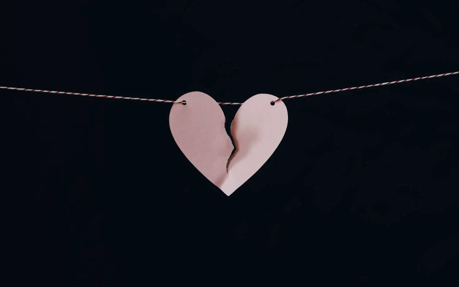 Pink broken heart on a line | Divorce and financial independence