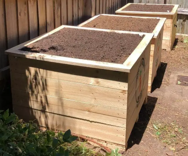 3 wooden wicking bed boxes