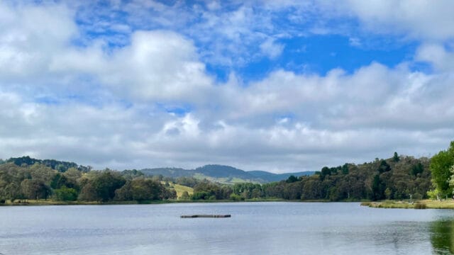 photo of water, sky and mountain